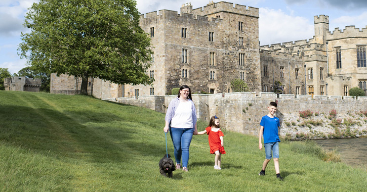 mother and two children walking dog at Raby Castle and Deer Park